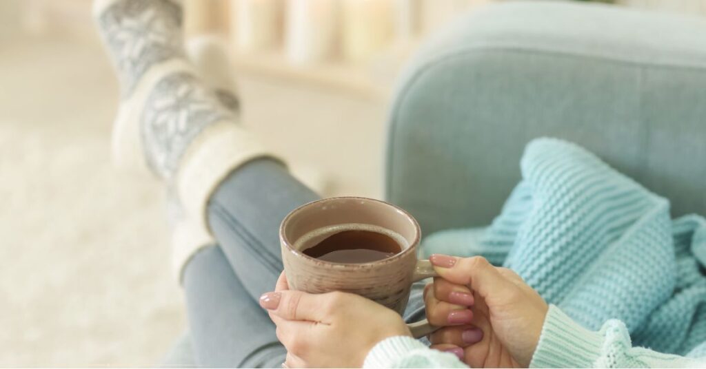 blurry, aesthetic "lifestyle" photo of a woman relaxing on a couch with a clean coffee table in front of her - image for Lazy Chaos Control