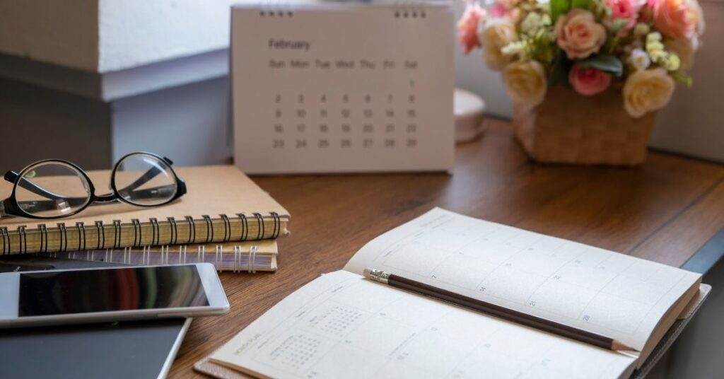 An aesthetic morning station with a planner and a smart speaker, Routine Anchors used during The Everyday Reset. 