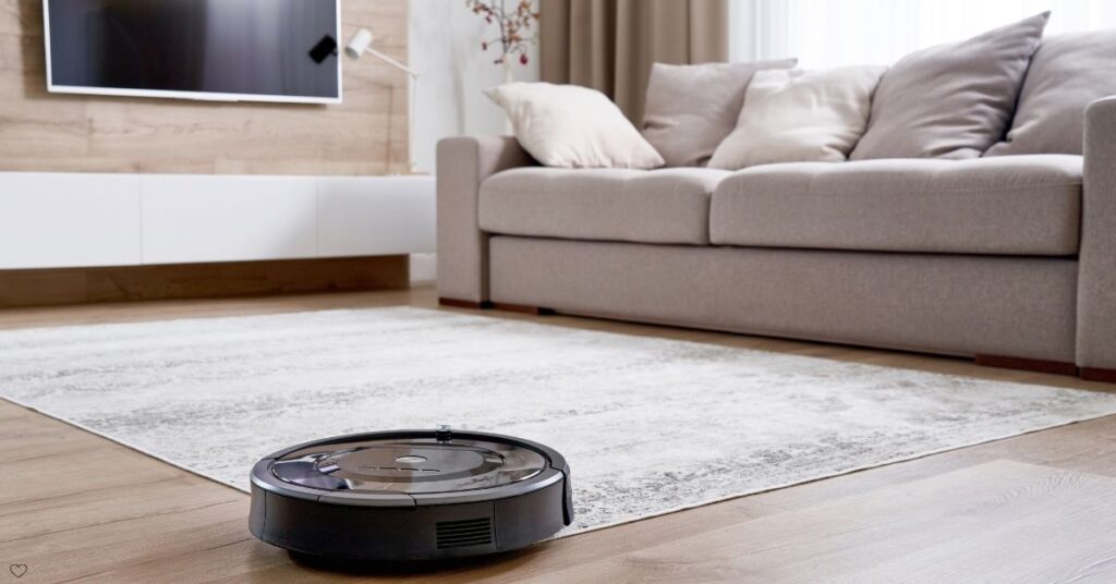 Robot Vacuum cleaning a modern hardwood floor automatically.